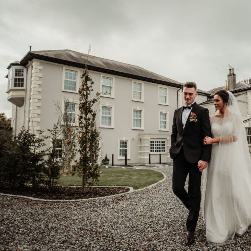 Bride & Groom in front of Newbay House