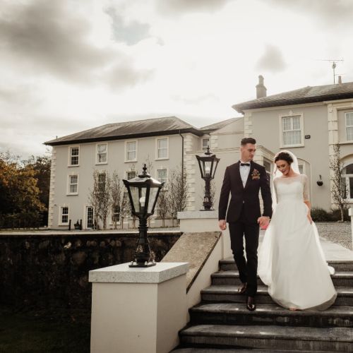 Bride & Groom in front of Newbay House